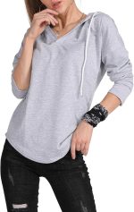 ⁦MAGICMK Women’s Deep V Neck Long Sleeves Drawstring Curved Bottom Sweatshirt Hoodie Loose Tops Blouses⁩ - الصورة ⁦3⁩