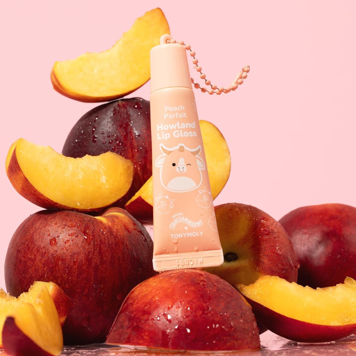 ⁦TONYMOLY x Squishmallows Howland Keychain Lip Gloss – Sheer Peach Tint, Hydrating & High-Shine Lip Balm with Peach Extract & Jojoba Oil, 11ml⁩ - الصورة ⁦2⁩